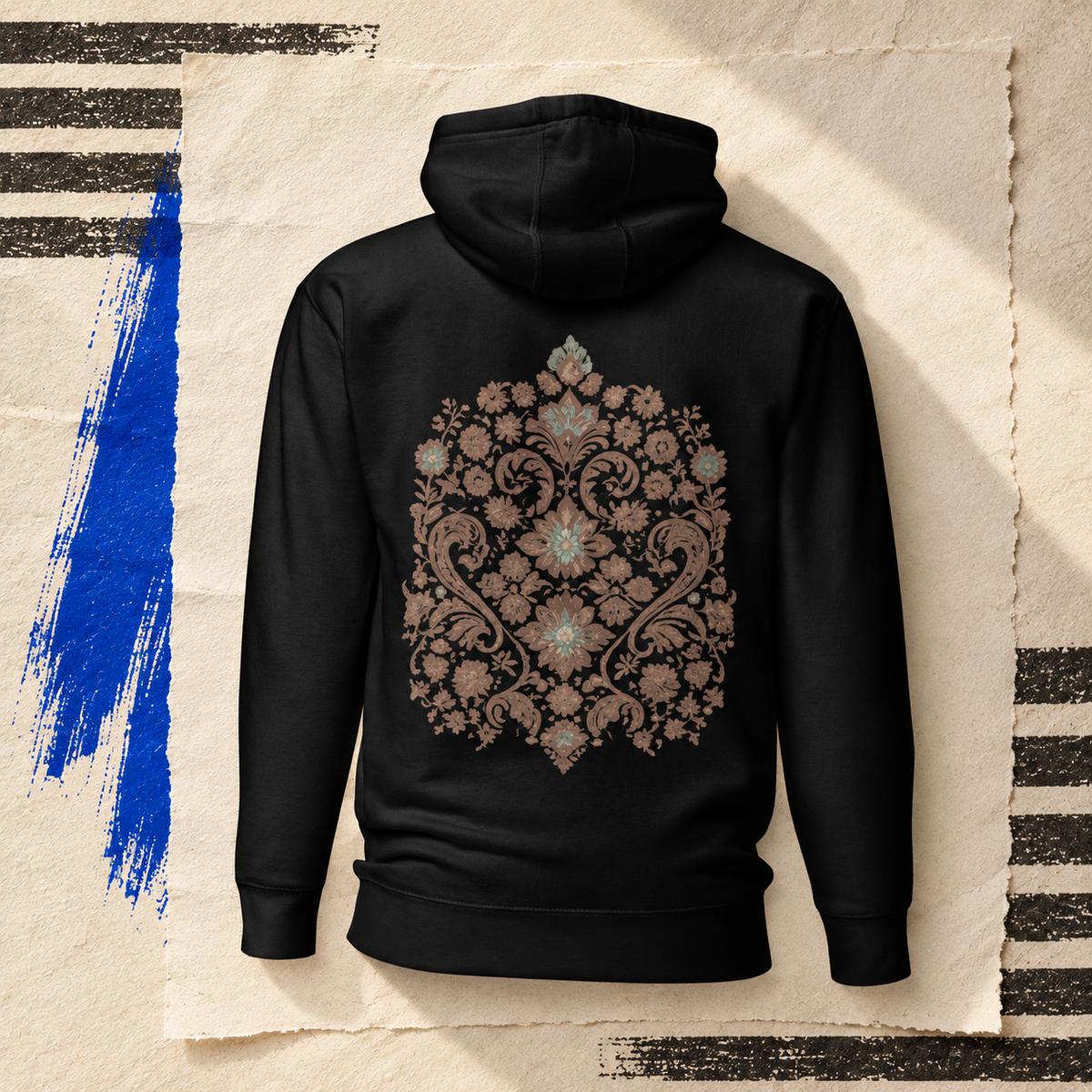 Black Verdigris Garden hoodie shown from the back, with brown and teal floral artwork on an ivory paper collage.