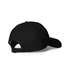 Rear-right view of a black dad hat showing the adjustable strap and metal buckle