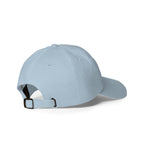 Rear-right view of a light blue dad hat showing the adjustable strap and metal buckle