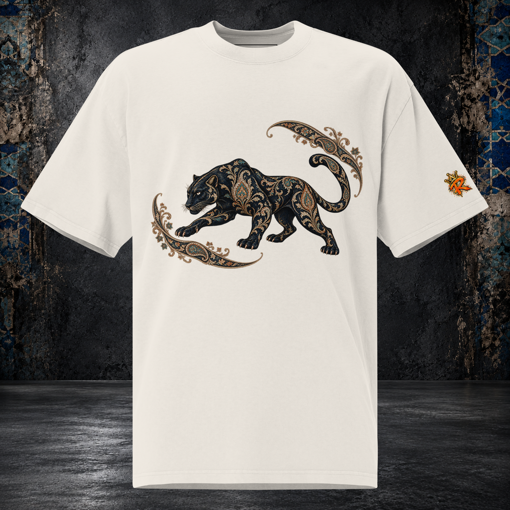 Front mockup of a faded bone oversized tee with a black panther, gold-toned ornament and curling paisley flourishes