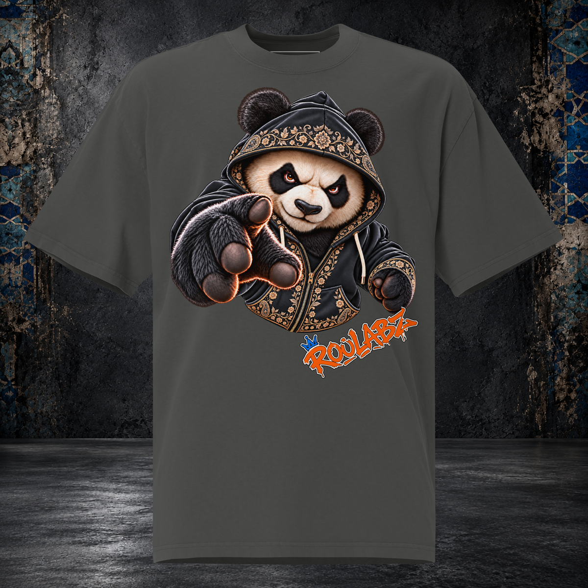 Front mockup of a faded coal oversized tee with a panda in a patterned hood reaching one gloved paw forward