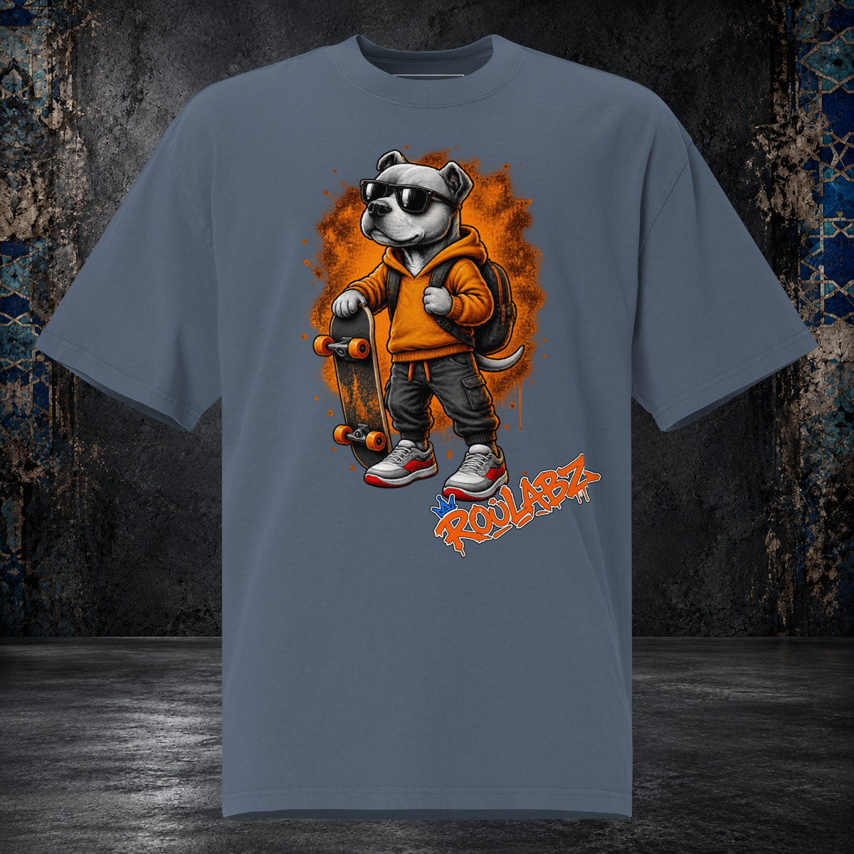 Front mockup of a faded indigo Skateboard Dog oversized tee with a dog in sunglasses carrying an orange backpack