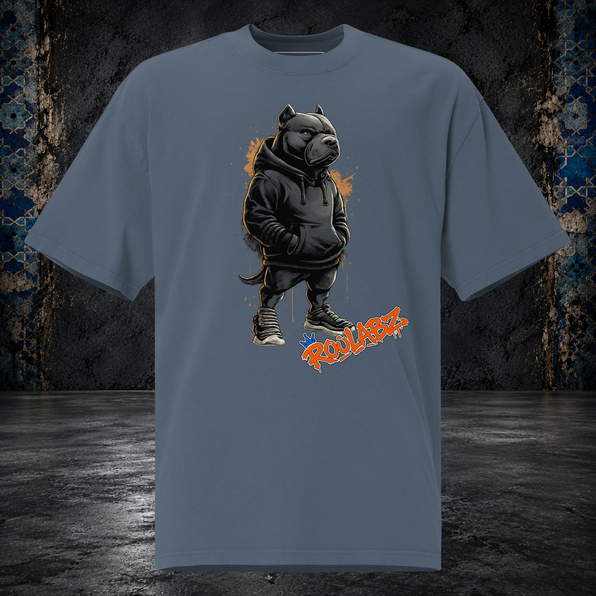 Front mockup of a faded indigo oversized tee with a pitbull character wearing a dark hoodie and headphones