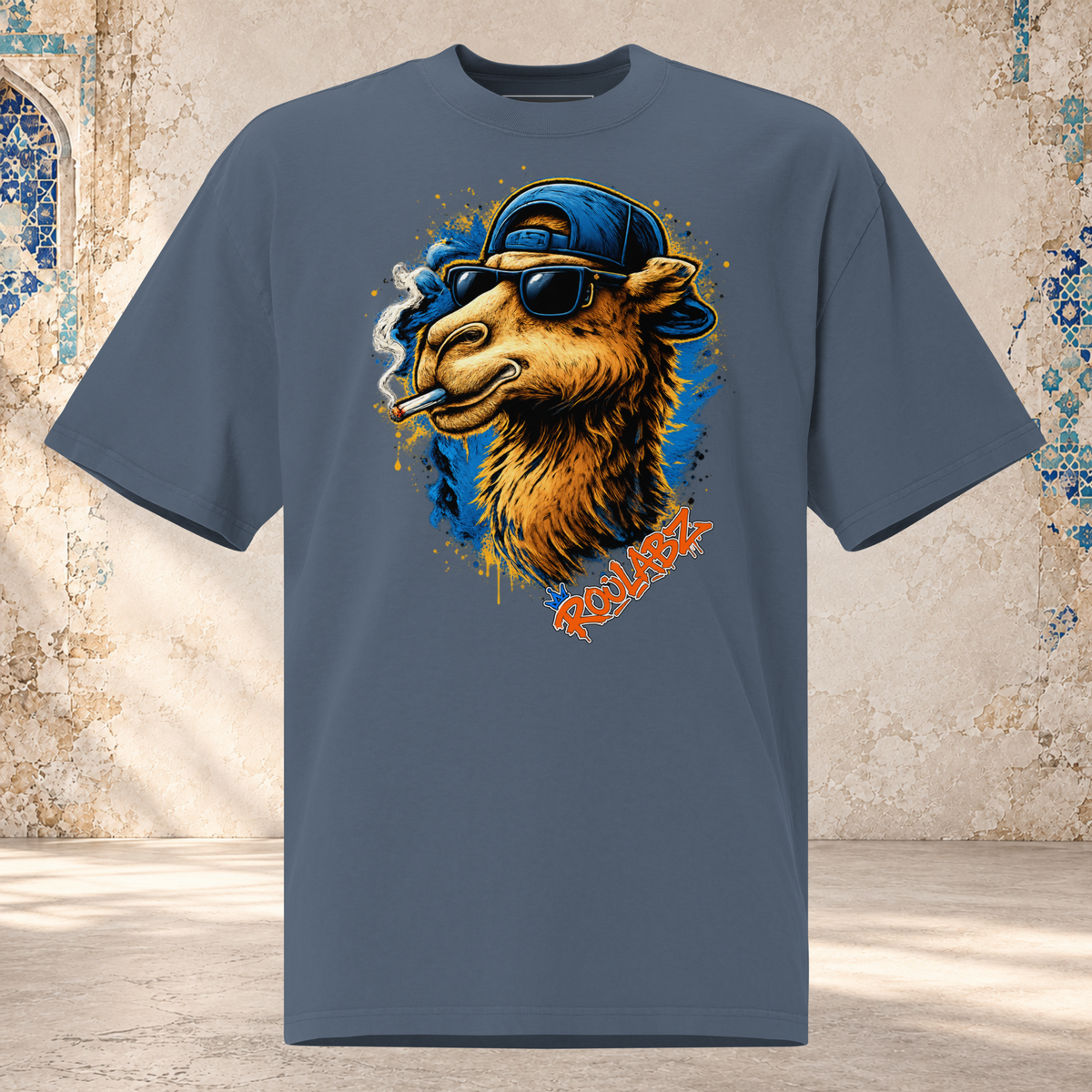 Front mockup of faded indigo oversized tee with a golden camel in sunglasses and a backward blue cap, curling cigarette smoke and blue splashes