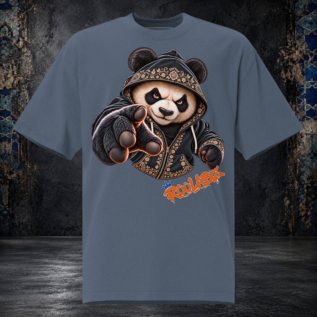 Front mockup of a faded indigo oversized tee with a panda in a patterned hood reaching one gloved paw forward