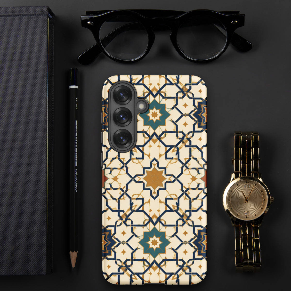 Persian Art case mockup for Samsung Galaxy S25 Plus on a dark desk, showing cream, gold and navy geometric tilework