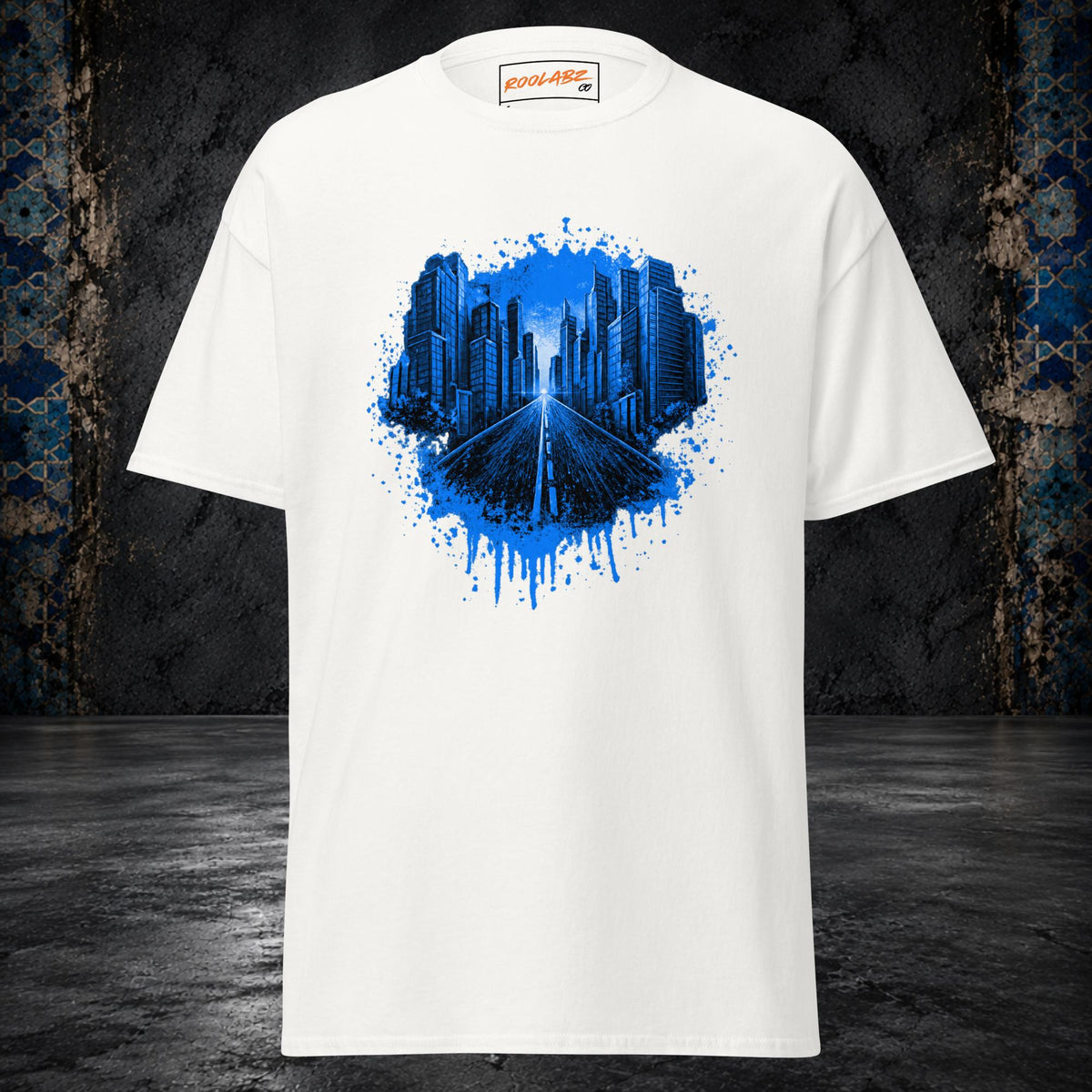 Front mockup of a white tee with an electric-blue skyline and highway framed by paint splashes and drips