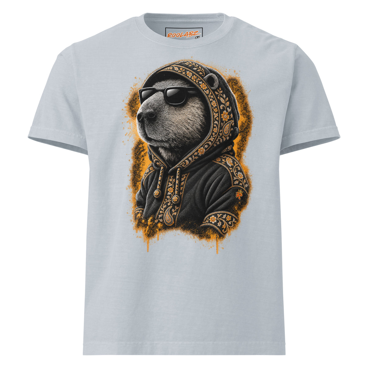 Front mockup of a light washed denim tee with a capybara in sunglasses and a black hoodie with gold-toned patterned trim