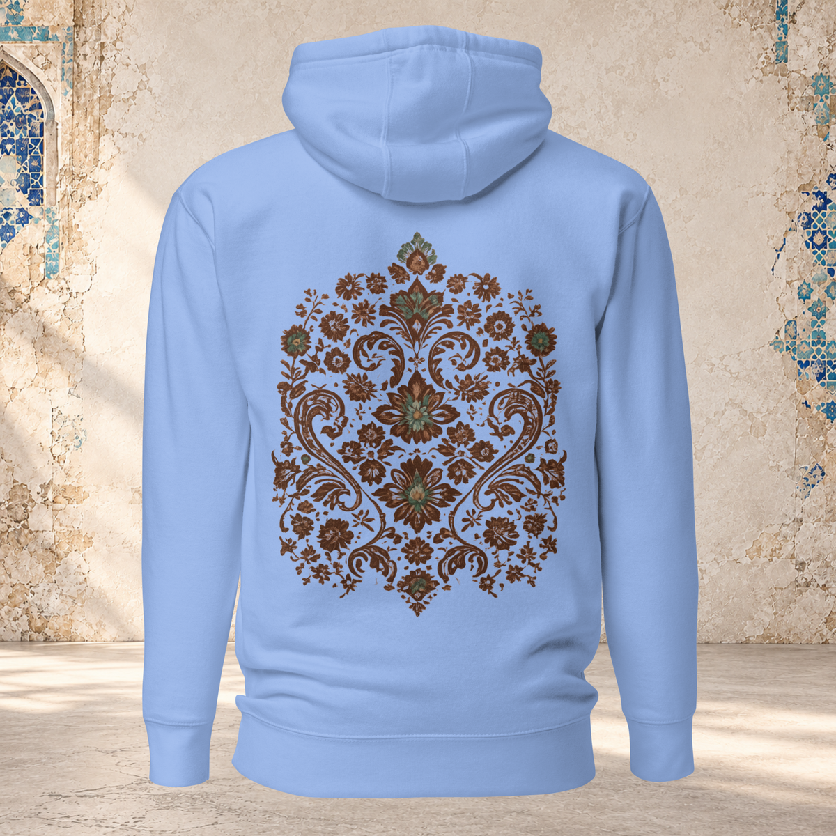 Back mockup of a Carolina blue Verdigris Garden hoodie with an ornate teal and brown floral medallion