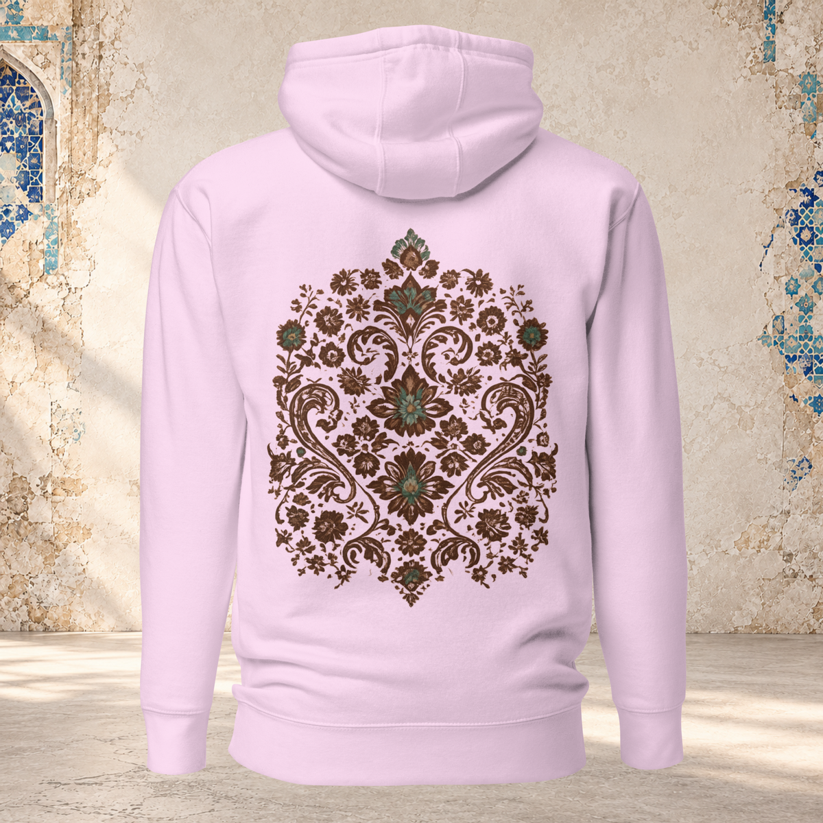 Back mockup of a lavender Verdigris Garden hoodie with an ornate teal and brown floral medallion