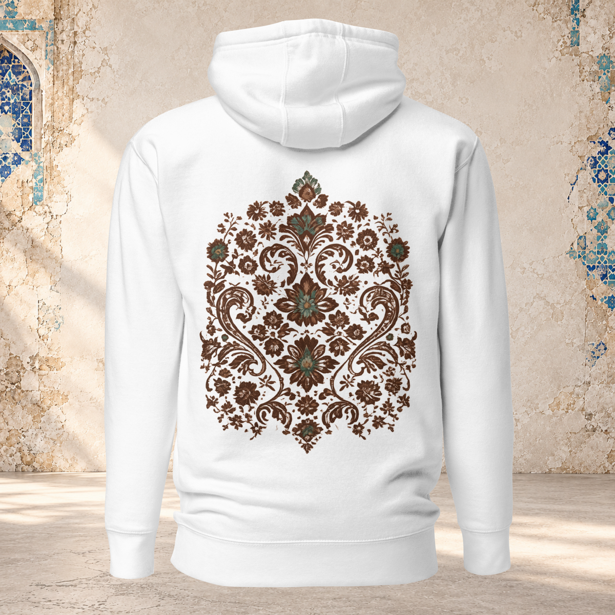 Back mockup of a white Verdigris Garden hoodie with an ornate teal and brown floral medallion