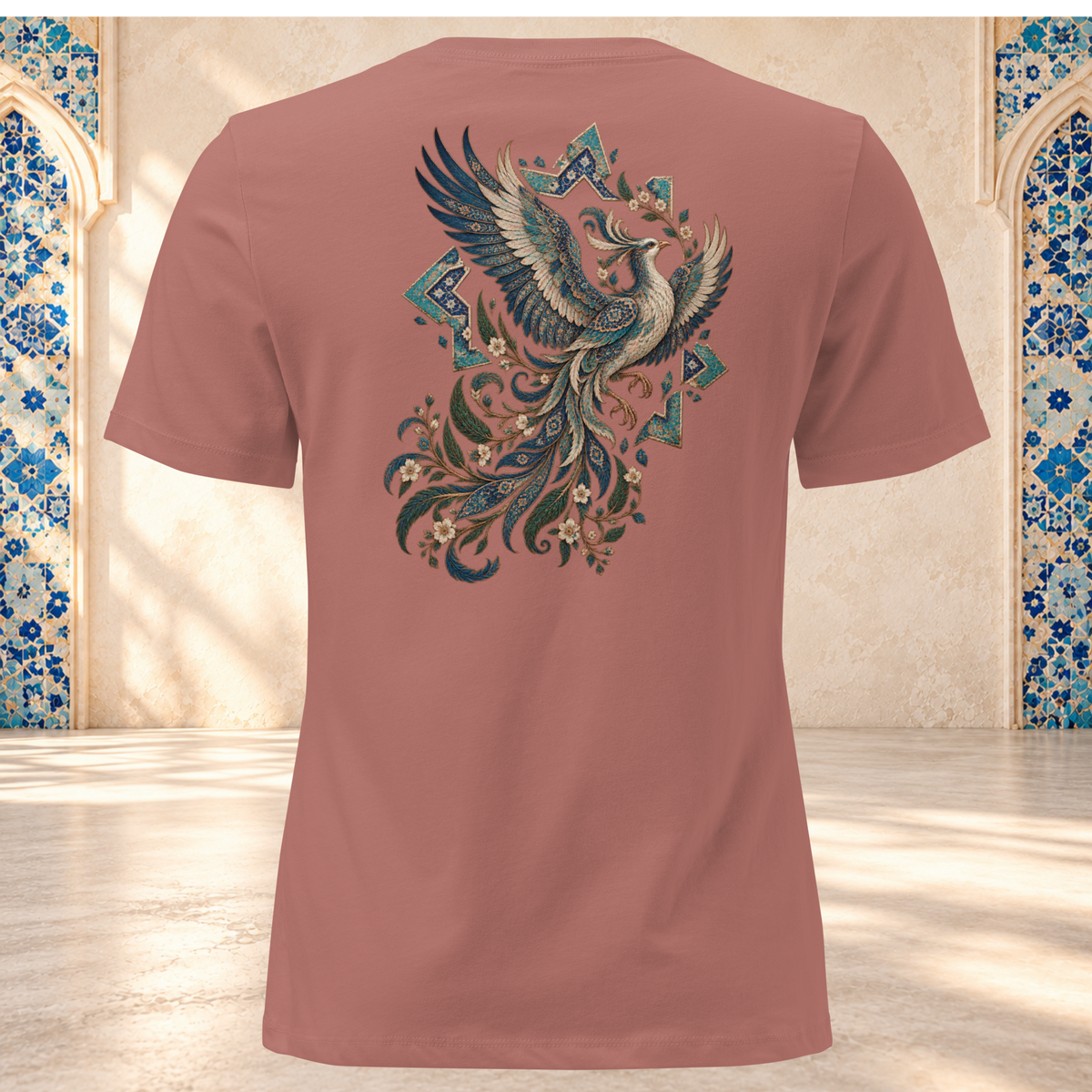 Back mockup of a mauve women's tee with an ornate Persian phoenix, raised wings and a sweeping teal and gold tail