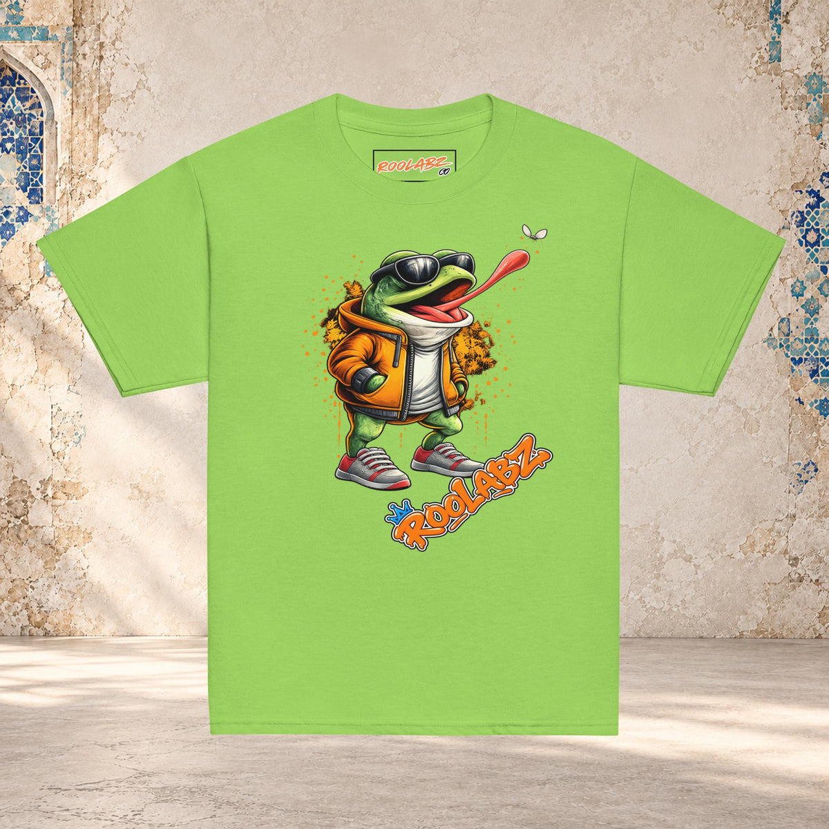 Front mockup of a lime youth tee with a frog in sunglasses reaching its tongue toward a fly