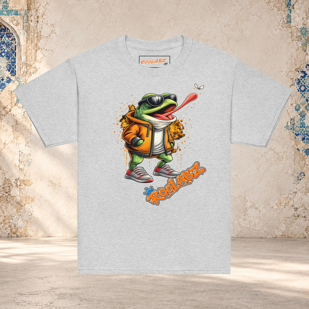 Front mockup of a sport grey youth tee with a frog in sunglasses reaching its tongue toward a fly