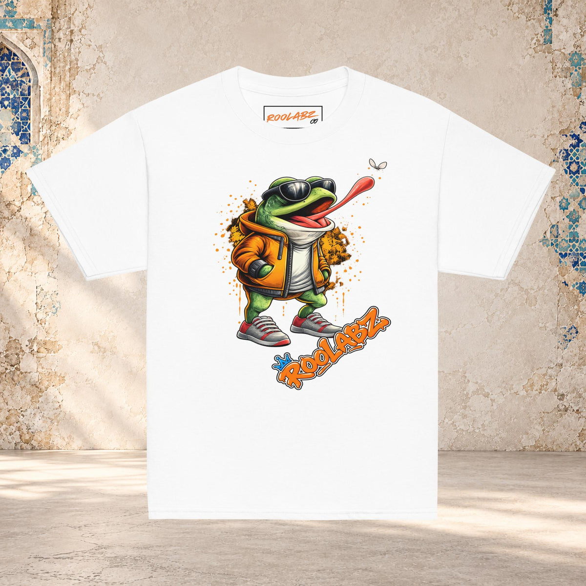 Front mockup of a white youth tee with a frog in sunglasses reaching its tongue toward a fly